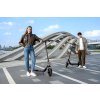 1222 17 f2 ii lifestyle picture couple smiling standing with ekickscooter