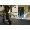 1222 5 f2 ii lifestyle picture guy riding girl walking by