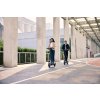 1177 3 ninebot f3 e lifestyle picture couple riding path building background
