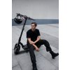 1183 5 ninebot max g3 e lifestyle picture guy sitting on kickscooter