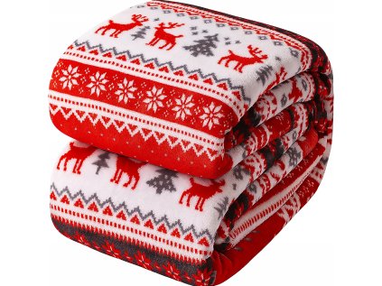 Zložená teplá deka s vianočným motívom – červené a biele pruhy so stromčekmi a jeleňmi.