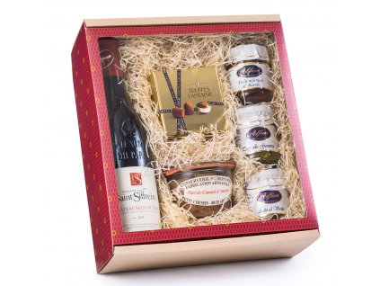 Dárkový balíček v červené elegantní krabici s průhledným víkem, uvnitř s vínem Châteauneuf du Pape, delikatesami a kakaovými lanýži Mathez