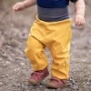 Batolecí softshellové kalhoty s kožíškem horčica