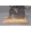 Silver angel sitting on a pedestal 98101820