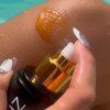 Opalovací voda SUN BRONZ s třpytivým efektem - Melon