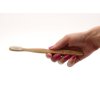 Ecobamboo dřevěný kartáček na zuby z bambusu (super soft) v ruce