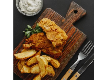 top view fish chips chopping board with cutlery