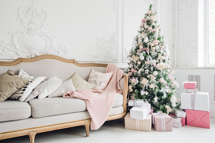 christmas-tree-with-a-white-sofa-in-a-white-room-PUS3FNJ