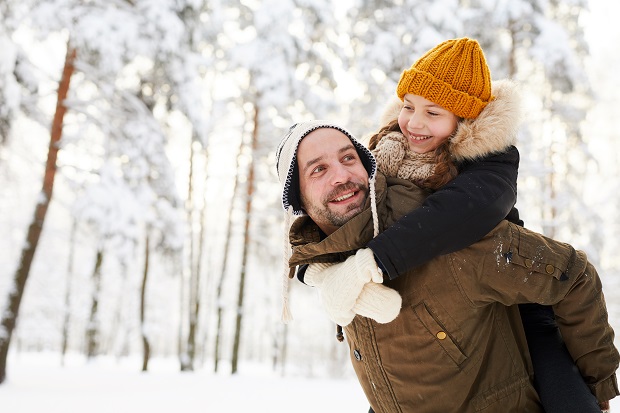 father-and-daughter-in-winter-forest-9HU6YC5