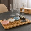Set na sushi, 9 dílů: bambusový podnos, hůlky a 4 porcelánové misky ve tvaru květu