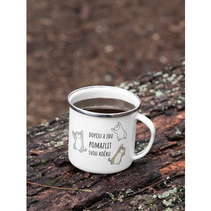 mockup of a 12 oz enamel mug with a silver rim placed on a fallen tree 30820 (13)