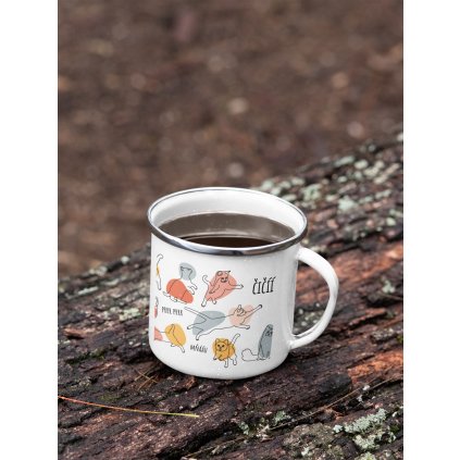 mockup of a 12 oz enamel mug with a silver rim placed on a fallen tree 30820 (12)