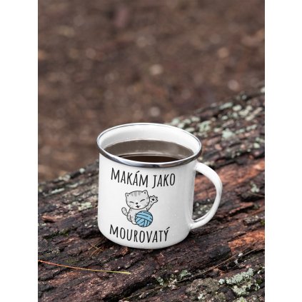 mockup of a 12 oz enamel mug with a silver rim placed on a fallen tree 30820 (8)