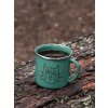 mockup of a 12 oz enamel mug with a silver rim placed on a fallen tree 30820 (2)