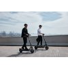 Ninebot Max G3 E Lifestyle picture port background two guys riding