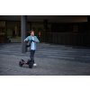Segway ZT3 Pro Lifestyle picture City vibe Man walking alongside kickscooter