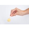 hand holding diced cheese with toothpick