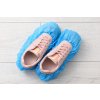 womens sneakers blue shoe covers light wooden floor top view