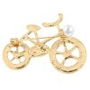 Bross - kerékpár, fehér gyöngyökkel és cirkonokkal díszített, arany színű
