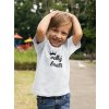 boy wearing a t shirt mockup while at a park with ducks a17942