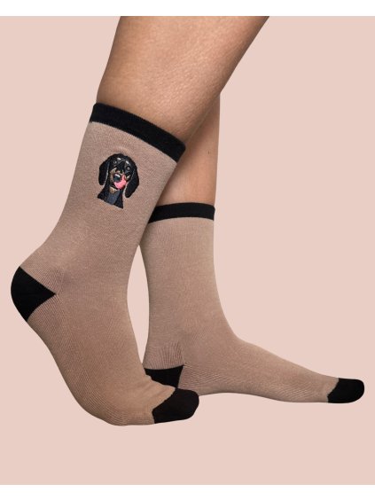 brown sock with black dog