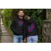 front and back mockup of a couple with customizable hoodies in the street 29786