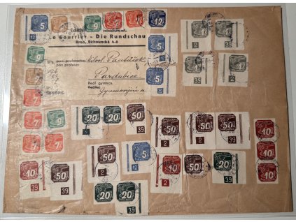 BuM 1940, Pof. NV 1-9, △ velká část obalu těžkého balíku s tiskovinami, se zjevně filatelisticky motivovanou, ale dobovou frankaturou, poštou prošlá firemní zásilka, v této podobě první nám známý kus!