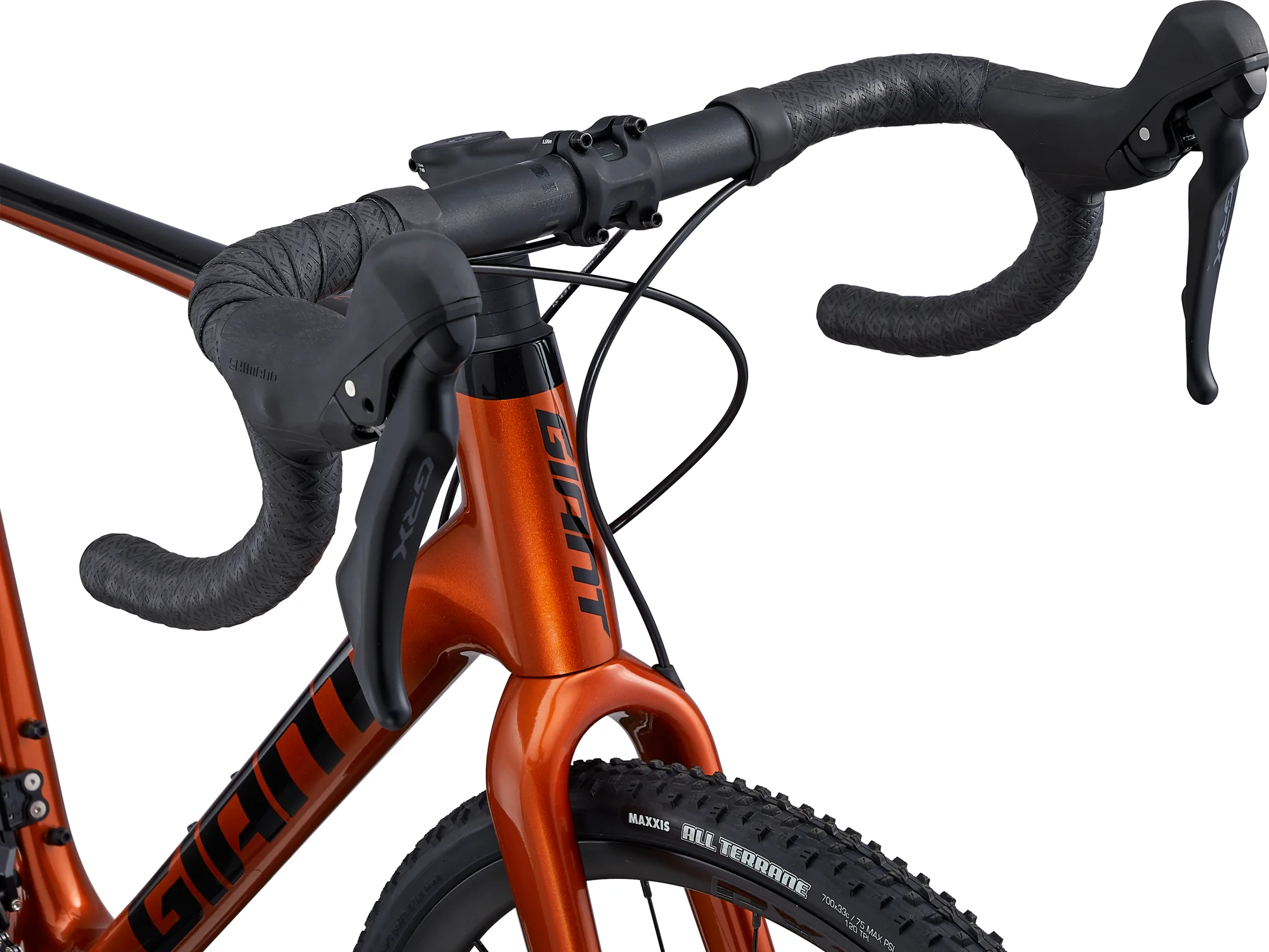 Řídítka, brzdové páky Shimano GRX a hlavová trubka kola Giant TCX Advanced Pro 2 v barvě Amber Glow