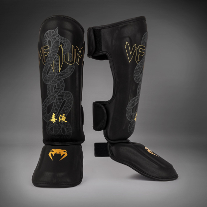 Chrániče holení Venum Serpenti - Black/Silver/Gold (Velikost M)