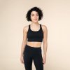 nb0100xs sports bra niyama essentials wmn sports bra crossed back schwarz front body