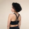 nb0100xs sports bra niyama essentials wmn sports bra crossed back schwarz side body