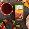 Tulsi s kurkumou a zázvorom porciovaný čaj Organic India background 4