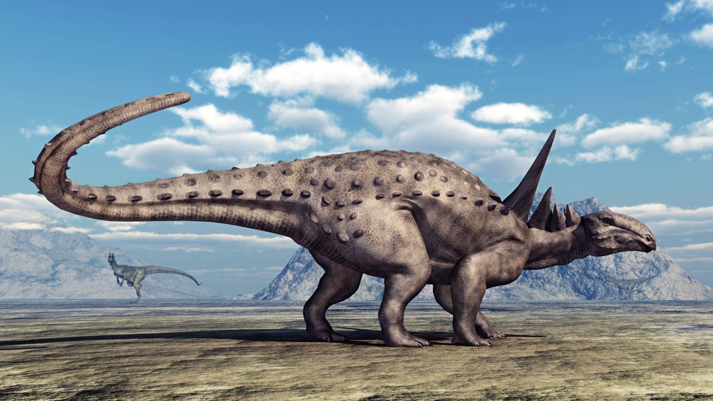 Sauropelta dinosaurus s výraznými trny podél těla, boční pohled na obrněného býložravce.