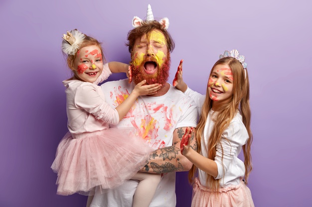 overloaded-fatigue-single-father-with-ginger-beard-cries-desperately-has-fun-with-two-female-kids-use-colourful-paints-have-happy-expressions-stand-purple-wall-happy-fathers-day-concept_273609-26130