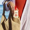 Spray 50 + incrane main dans sac