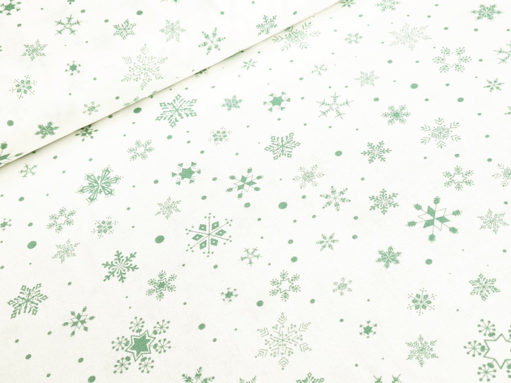 Bavlněné plátno - Pastelově zelené vločky na krémově bílé