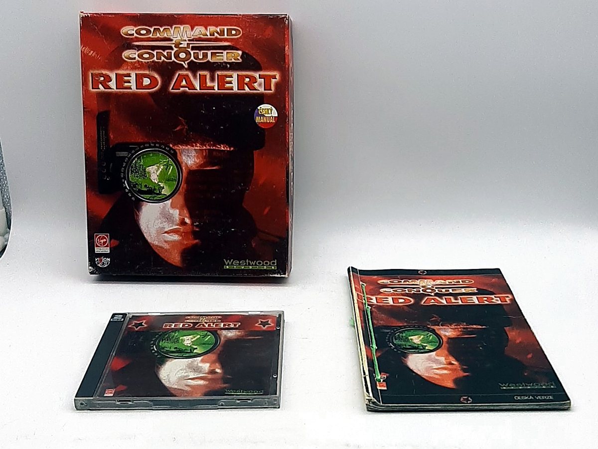 Big box Command and Conquer: Red Alert, vedle něj disk v pouzdře a tištěný manuál