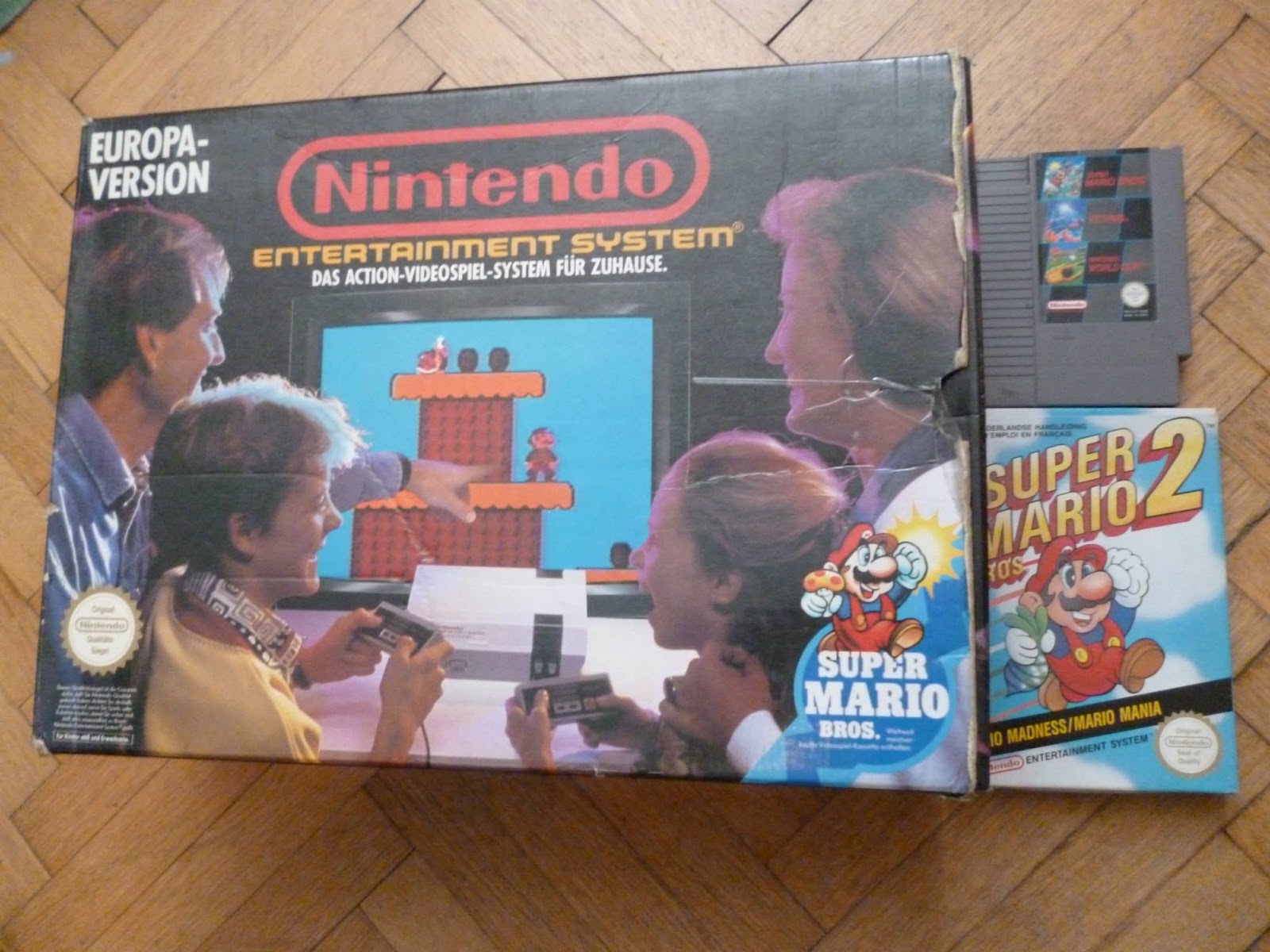 NES konzole s krabicí a Super Mario Bros 2