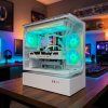 Bílý herní PC GamePC Raiko Pro s Ryzen 5 7500X3D a RTX 5070 v herním setupu s RGB osvětlením