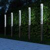 Sada 5 LED solárních lamp - bílá u chodníku