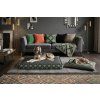 alt="Dog on the Jungle Pearl pillow bed – maximum comfort for large breeds,