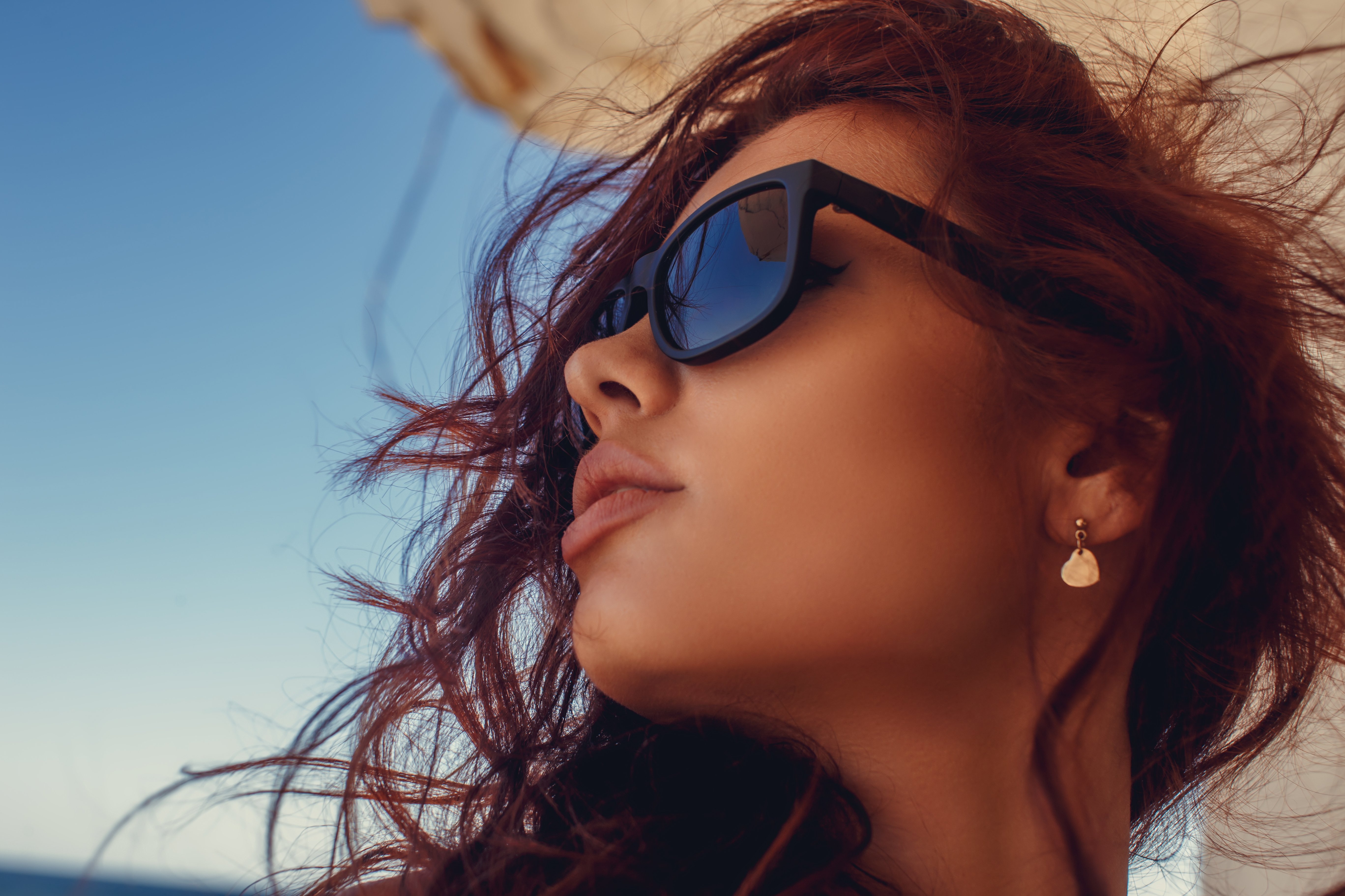 portrait-woman-with-red-hair-sunglasses