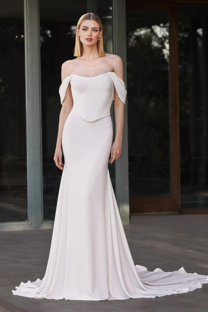 svatebni saty polenia kolekce pronovias 2026 hladke krepove minimaliaticke spadla raminka korzet mermaid splyvava sukne 2