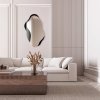 Lustro Libido nieregularne lustro naklejone na czarne szklo Lacobel, jako dekoracja w nowoczesnym salonie. GieraDesign