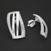 077 sleek silver hoop earrings on dark backdrop