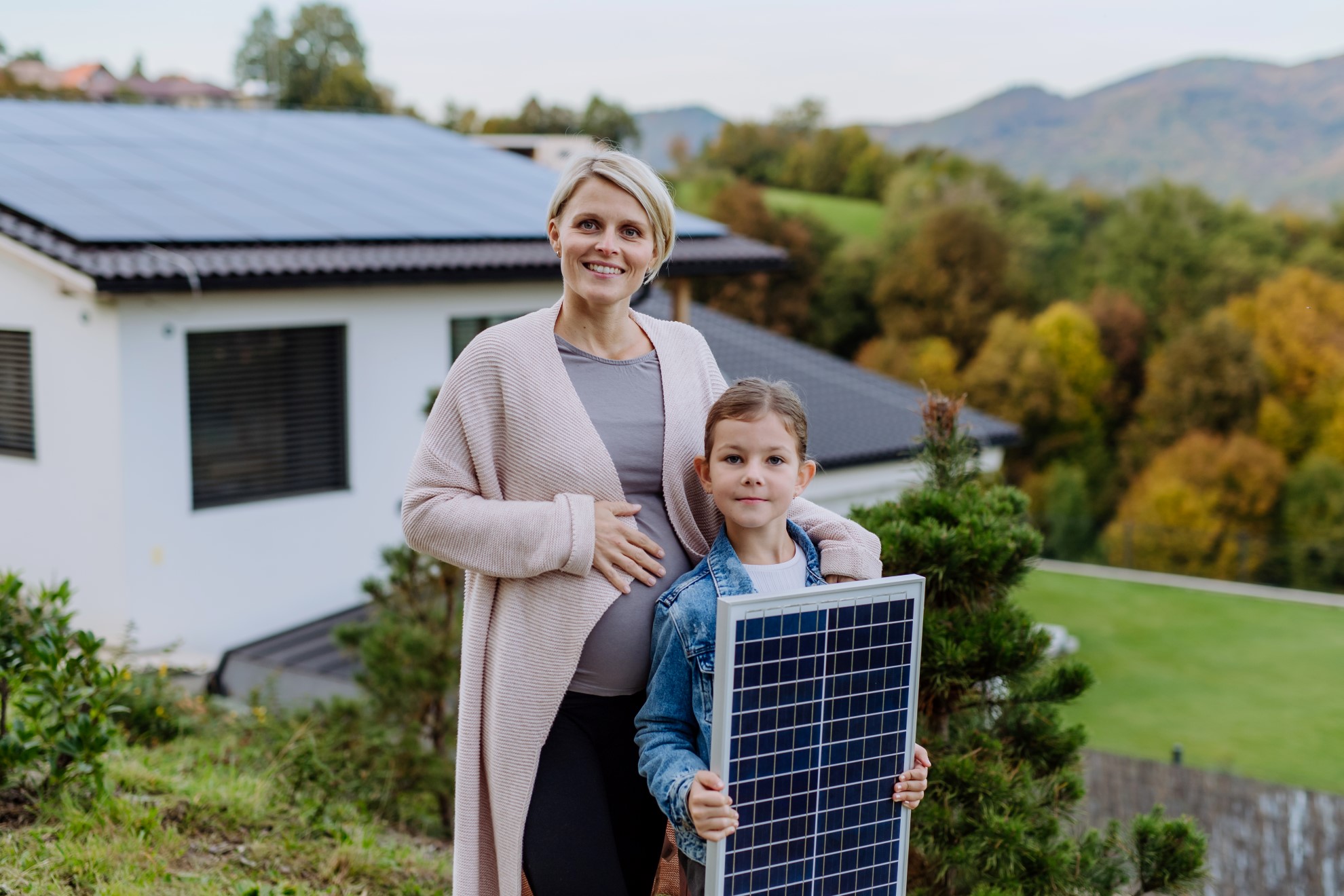 mother-with-her-little-daughter-near-their-house-w-2022-11-02-02-39-10-utc