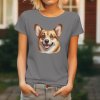 Dámské tričko s detailním realistickým potiskem hlavy usměvavého psa plemene Welsh Corgi Pembroke.