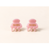 Two glossy pink HABIBI clips