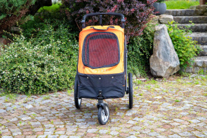  Kočárek pro psy s 38cm kolečky a nosností až 30 kg. Rozměry kabiny 72 × 45 × 60 cm, možnost připevnění upravovacího stolku. Barva černo-oranžová.