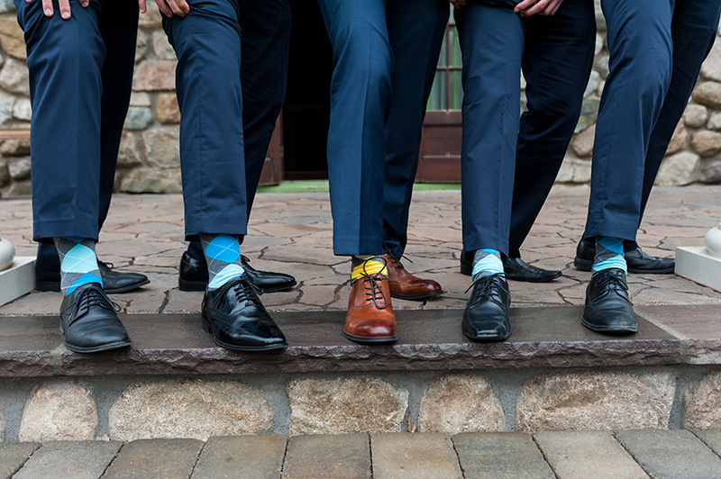 groomsmen-navy-suits-argyle-socks-black-and-brown-wedding-shoes